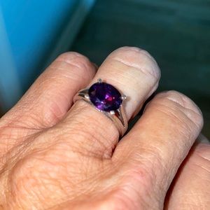 Elegant amethyst ring set in sterling silver solitaire. Size 7